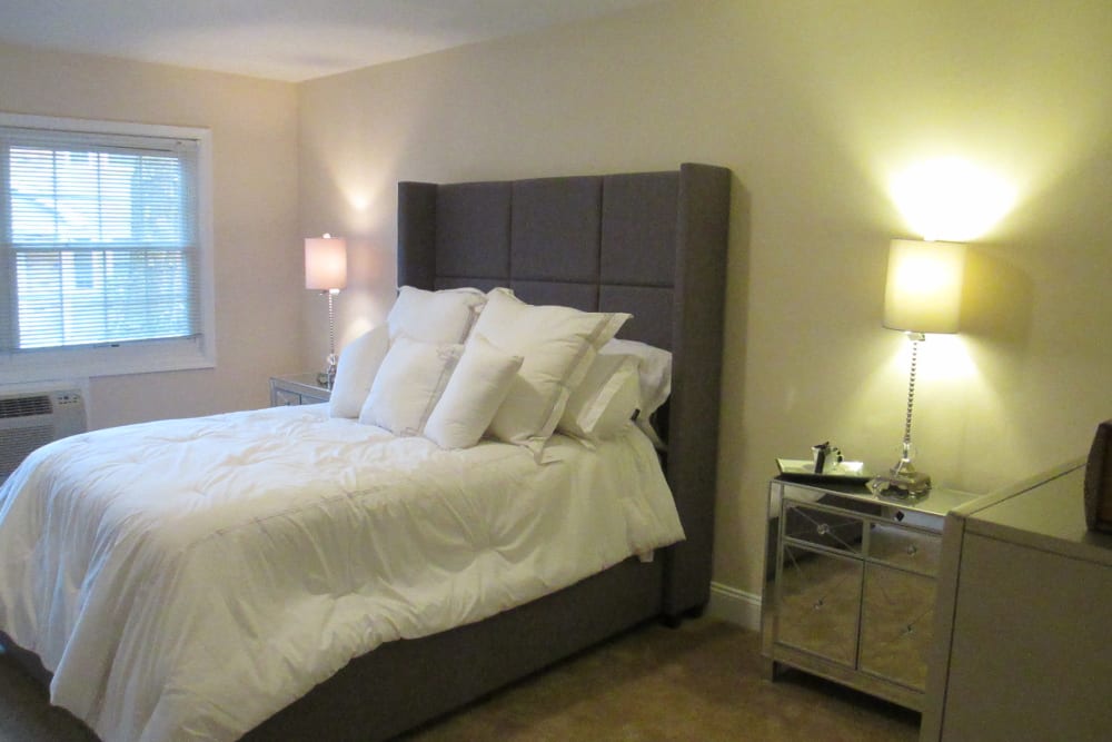Master bedroom at Eagle Rock Apartments at Woodbury in Woodbury, New York