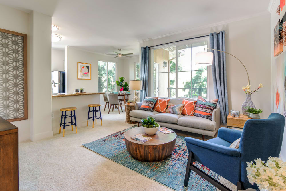 Spacious living room with back patio access at Sofi Shadowridge in Vista, California