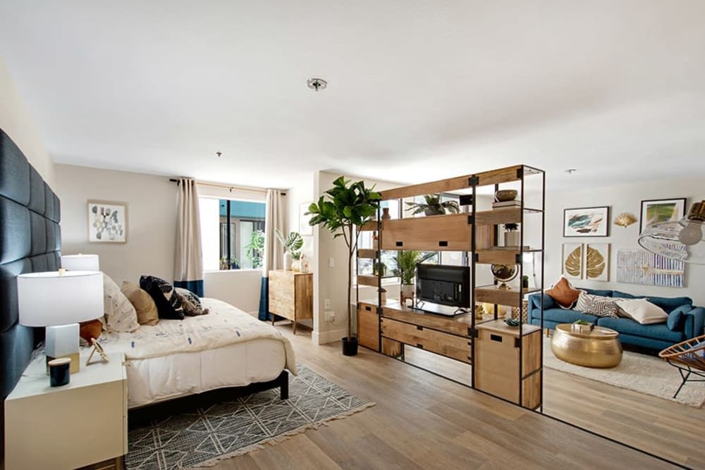 Studio floor plan with hardwood floors and modern decor in a model home at Vue Los Feliz in Los Angeles, California