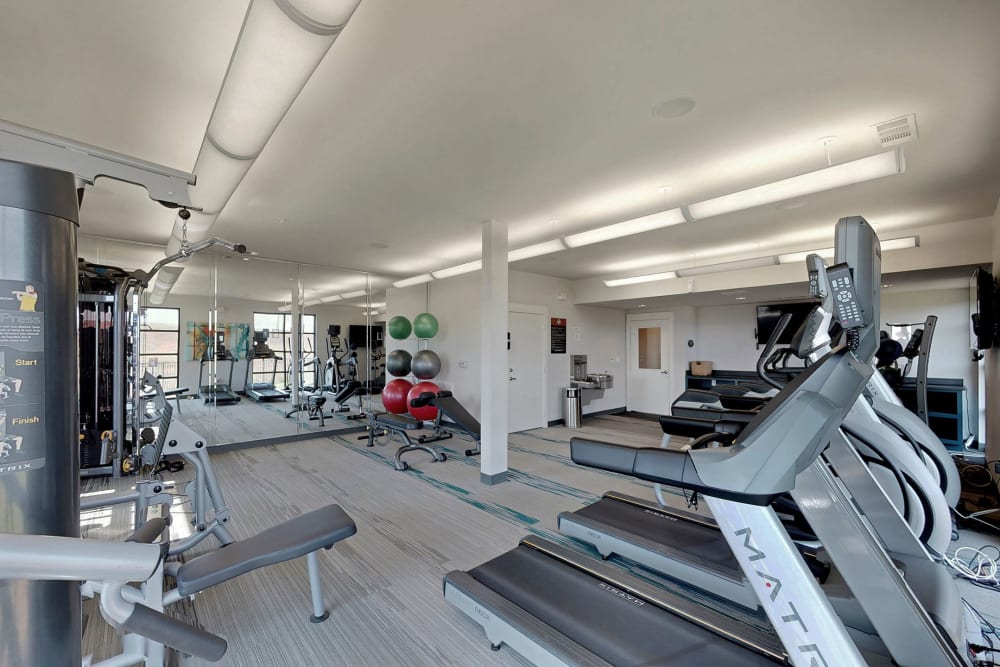 Fully equipped fitness center at Oaks Trinity in Dallas, Texas