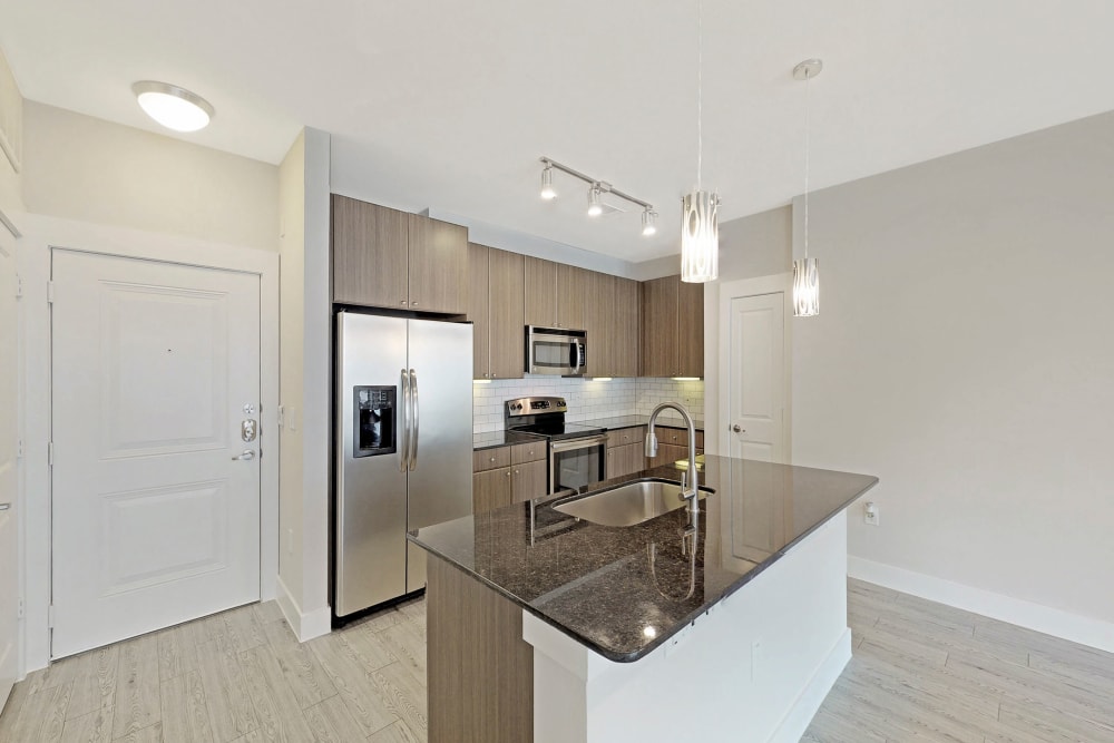 Spacious kitchen with granite countertops at Oaks Trinity in Dallas, Texas