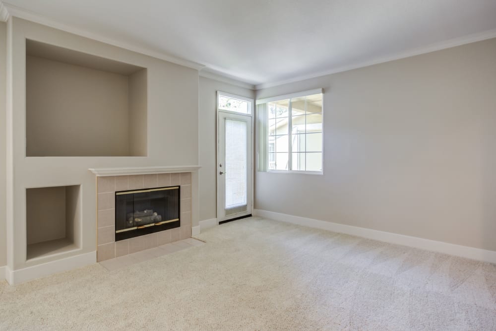 Fireplace and extra shelf space in the living area of a model home at Sofi Highlands in San Diego, California 