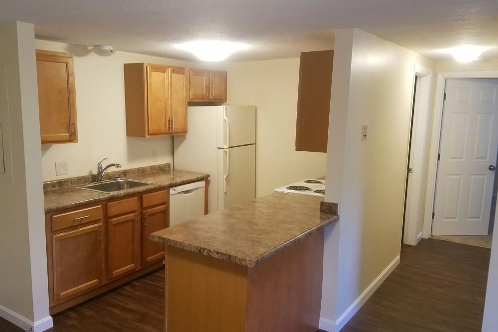Kitchen with granite counters at London Court Apartments in Merrimack, New Hampshire