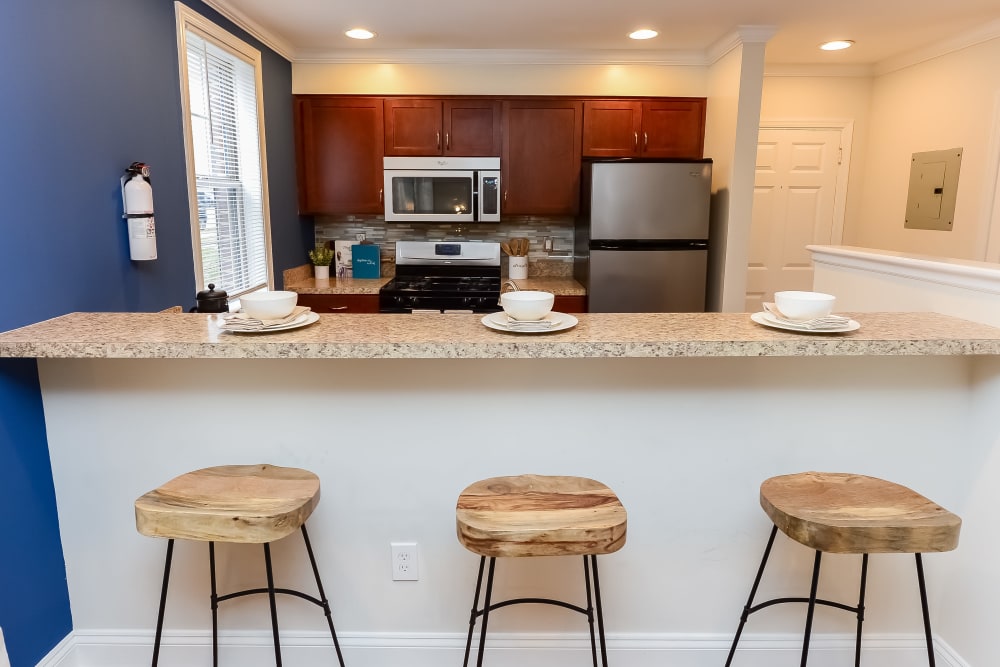 Kitchen with bar stools at The Villas at Bryn Mawr Apartment Homes