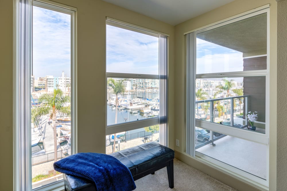 View of the marina from a beuatiful window lounge at Harborside Marina Bay Apartments in Marina del Rey, California