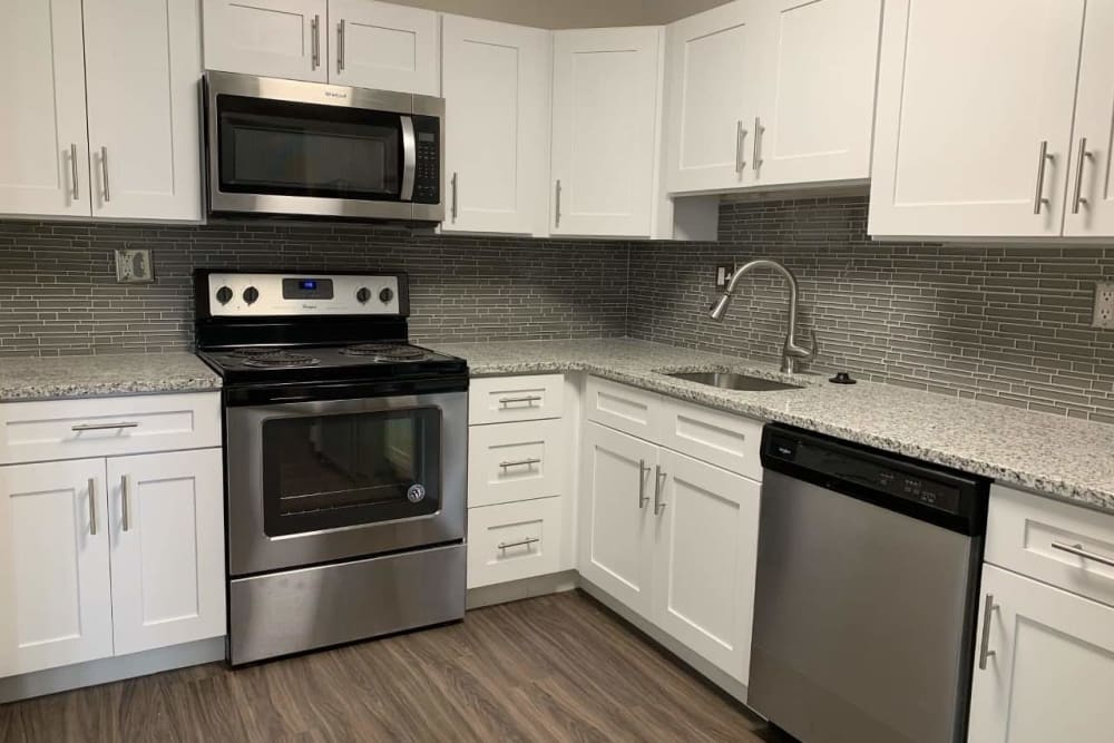 Kitchen with modern white cabinetry at Eastampton Gardens Apartment Homes in Eastampton, NJ