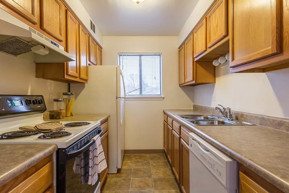 Fully-equipped kitchen at Crossroads Apartments & Townhomes in Spencerport, New York