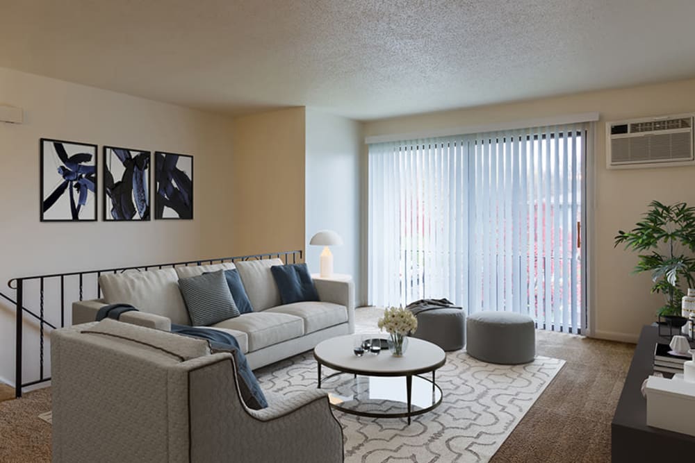 Naturally well-lit living room at Crossroads Apartments & Townhomes in Spencerport, New York