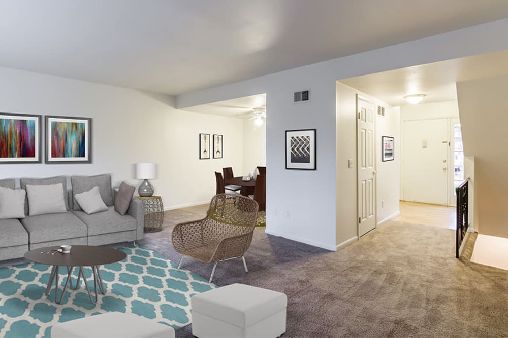 Spacious, bright living room at Elmwood Terrace Apartments & Townhomes in Rochester, New York