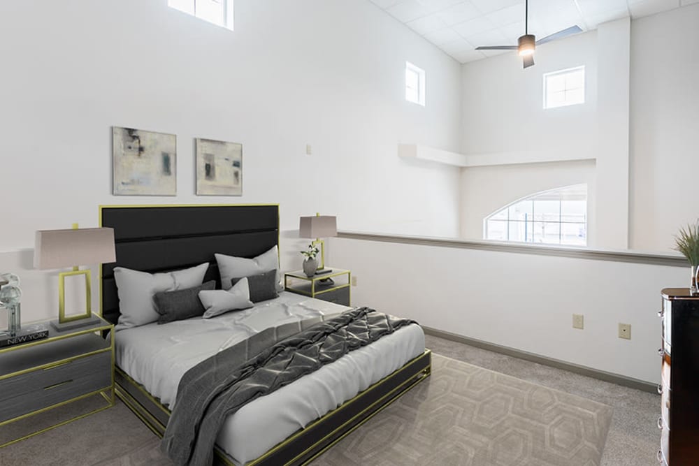 Modern, stylish bedroom at Greenwood Cove Apartments in Rochester, New York