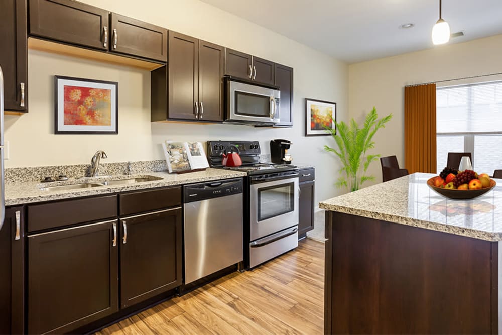 Fully equipped kitchen at Ethan Pointe Apartments home in Rochester, New York