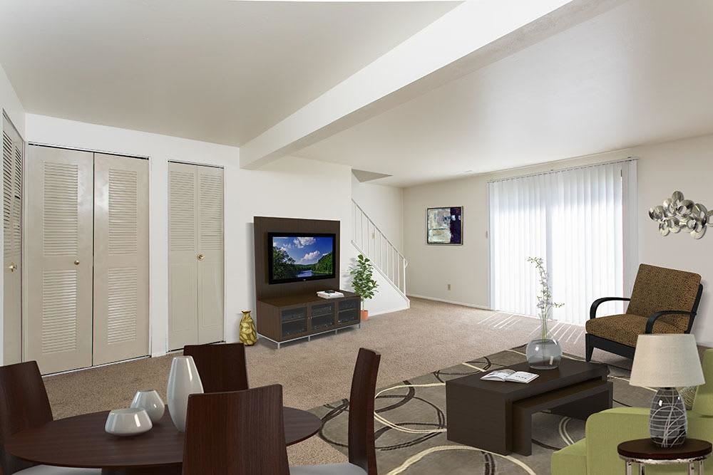 Spacious living room of a model home at High Acres Apartments & Townhomes in Syracuse, New York