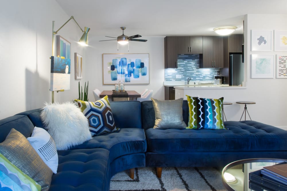 Well-decorated living space in the open-concept floor plan of a model home at Sofi Belmont Glen in Belmont, California