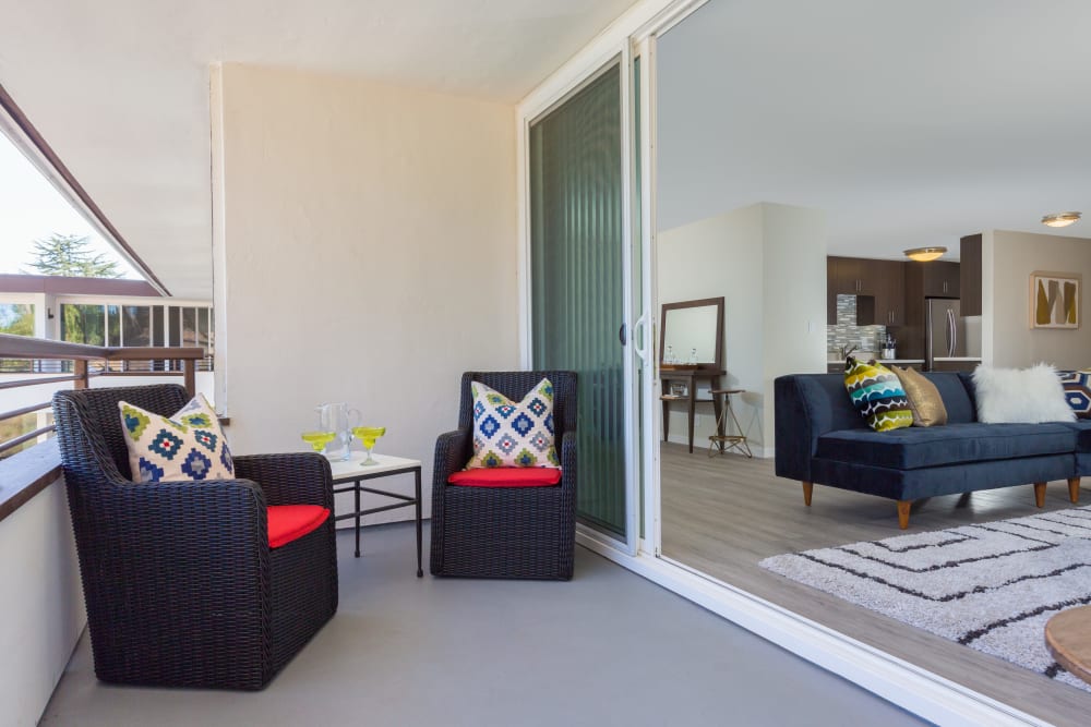 Large, well-decorated private balcony outside a model home at Sofi Belmont Glen in Belmont, California