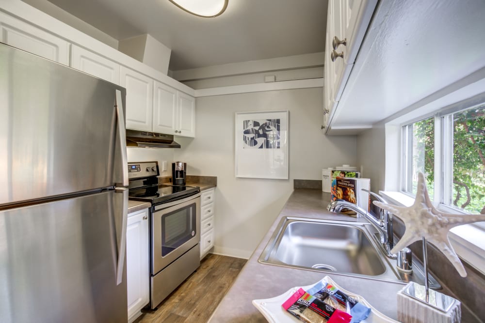 Modern kitchen with quartz countertops and stainless-steel appliances in a model home at Sofi Fremont in Fremont, California