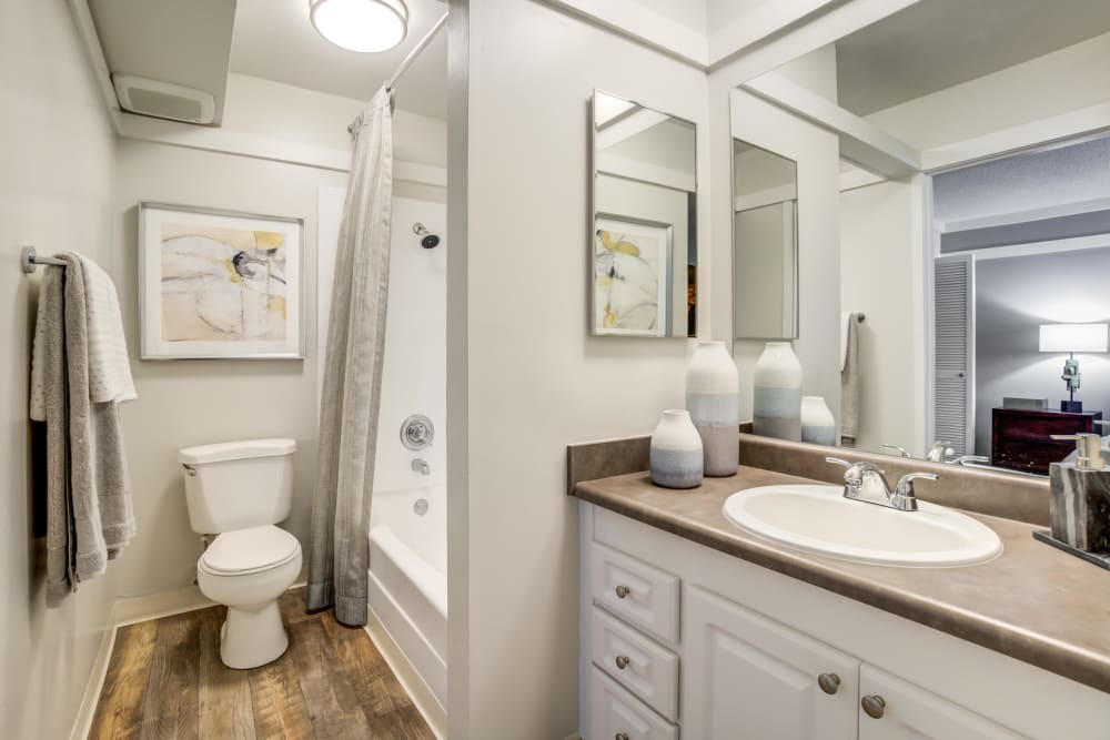 Large vanity mirror and a quartz countertop in a model home's bathroom at Sofi Fremont in Fremont, California