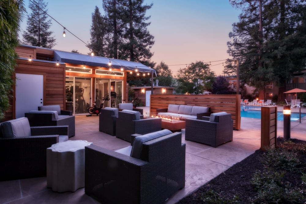 Outdoor lounge with fireplace at Brookdale Apartments in San Jose, California