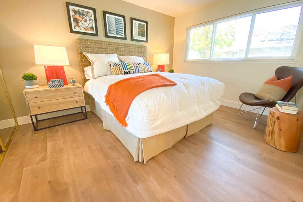 Bedroom with wood-style flooring at Cypress Pointe Apartments in Gilroy, California