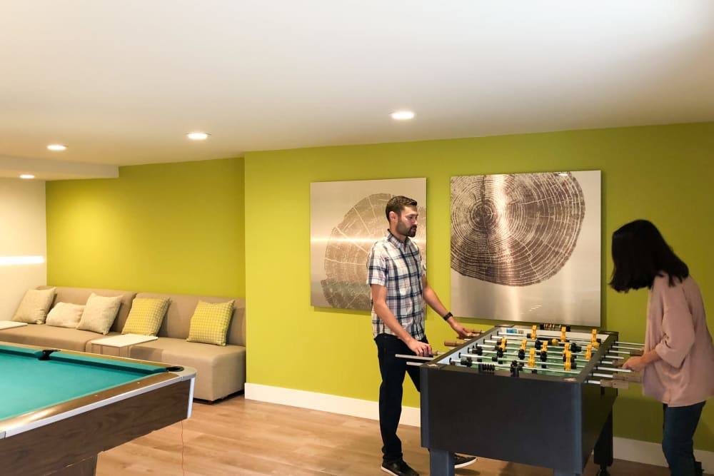 Residents playing foosball at Greendale Apartments in Mountain View, California
