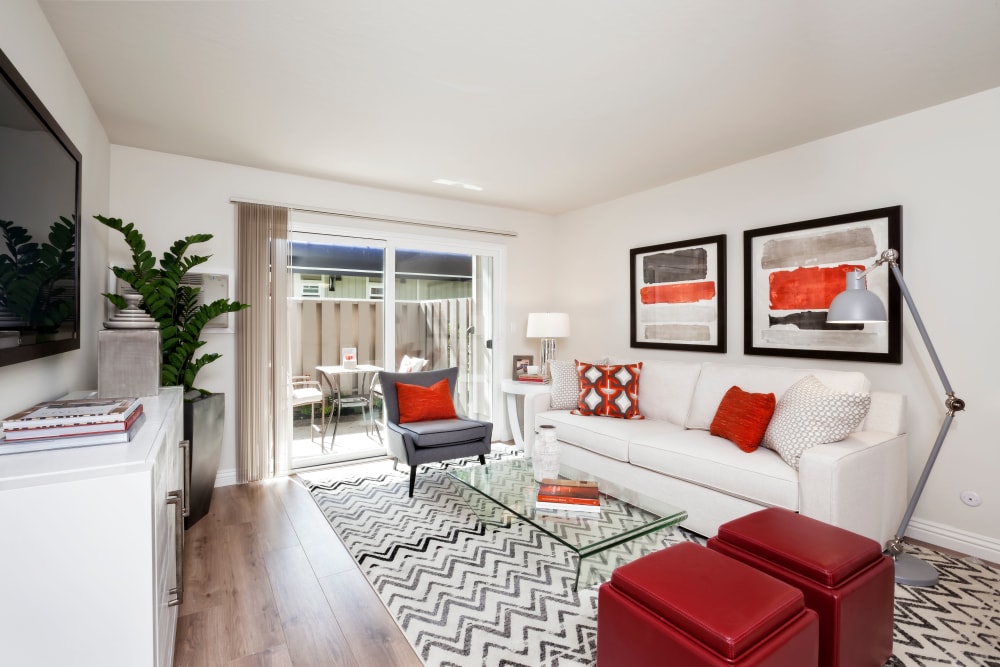 Bright living room with wood style flooring at Halford Gardens Apartments in Santa Clara, California