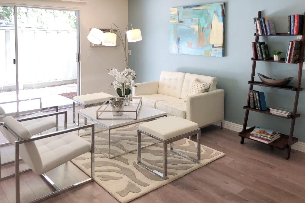 Living room with wood-style flooring at Newport Apartments in Campbell, California