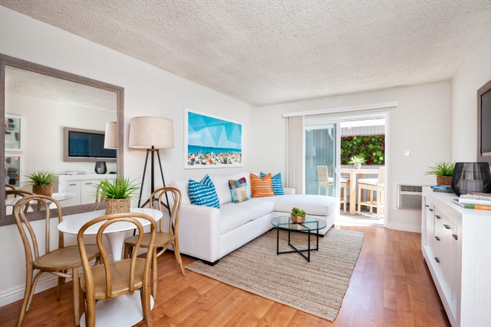 Living room with wood-style flooring at Parkwood Apartments in Sunnyvale, California