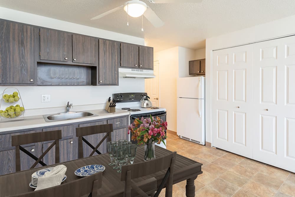 Dining area with a ceiling fan at Hilton Village II Apartments in Hilton, New York