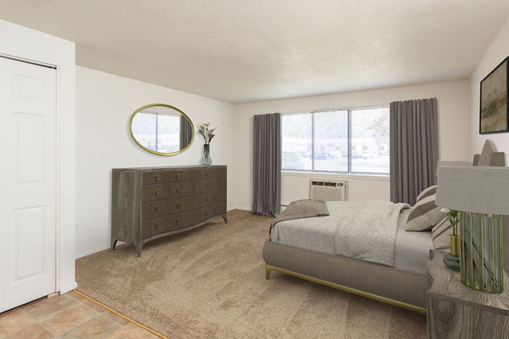 Large bedroom with plush carpeting at Hilton Village II Apartments in Hilton, New York