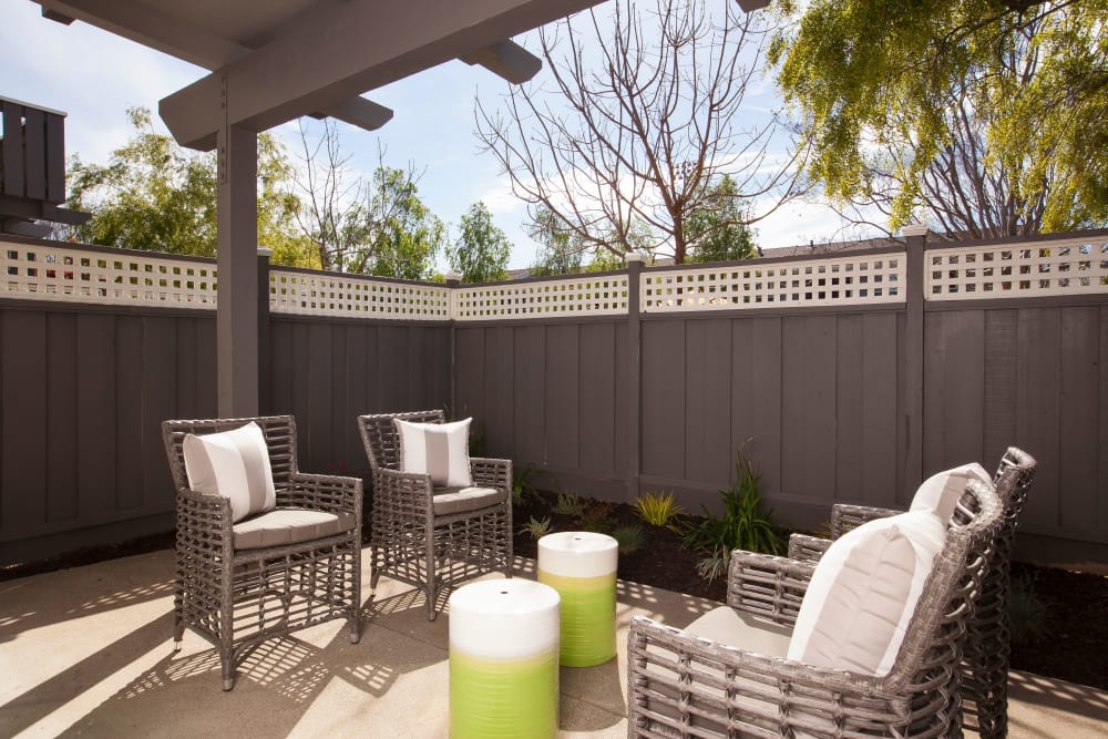 Private patio with furniture at Village Green Apartments in Cupertino, California