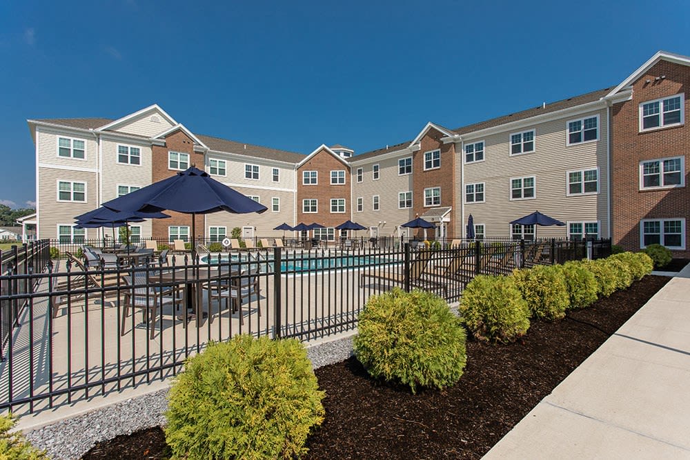 Well landscaped grounds of The Marquis at the Woods in Webster, New York