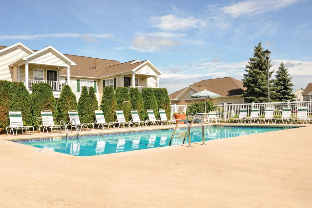 Sparkling swimming pool and sundeck lounge chairs at Westview Commons Apartments in Rochester, New York
