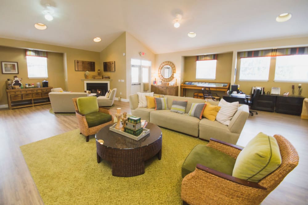 Community clubhouse with comfortable couches at Glade Creek Apartments in Roanoke, Virginia