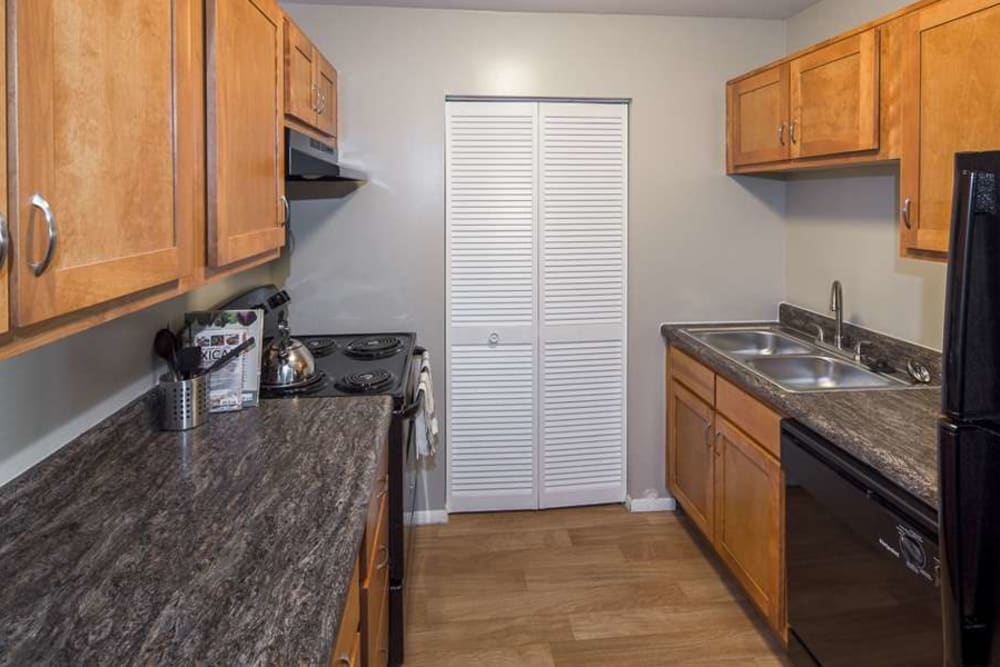 Kitchen with black appliances at The Summit at Ridgewood in Fort Wayne, Indiana