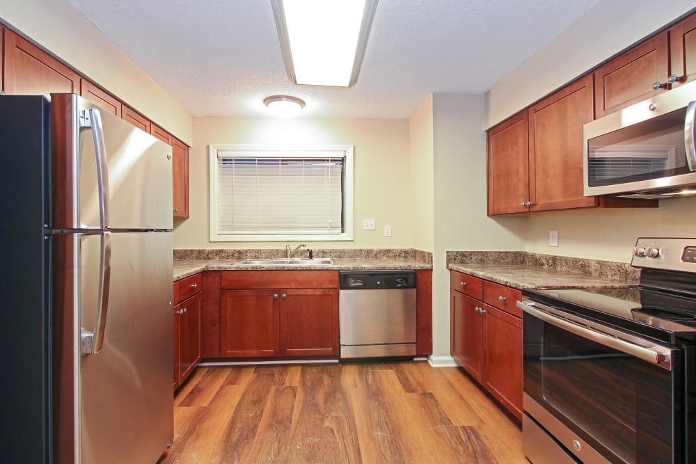 Fully equipped kitchen at The Lodge on the Chattahoochee Apartments in Sandy Springs, Georgia