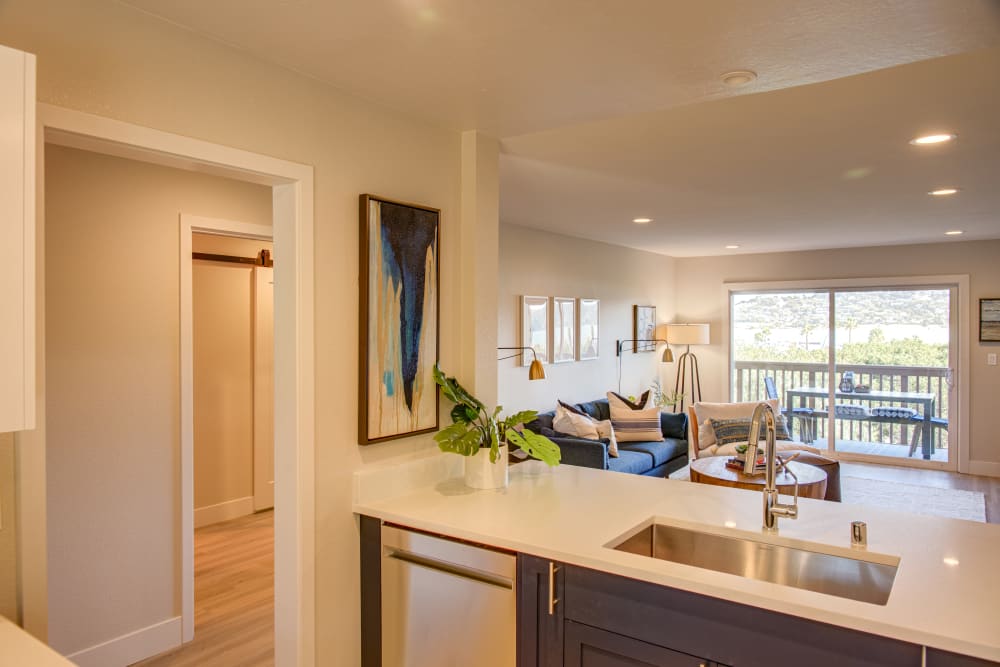 Overlooking the living area from the kitchen of a model home at Harbor Point Apartments in Mill Valley, California