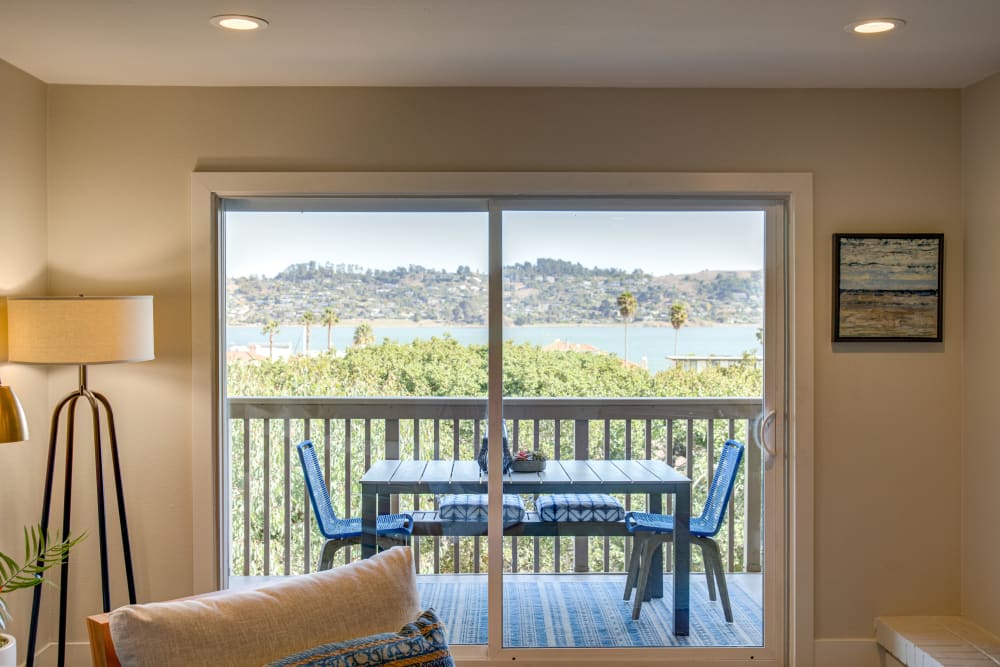 Sliding doors leading to the private balcony outside a model home at Harbor Point Apartments in Mill Valley, California