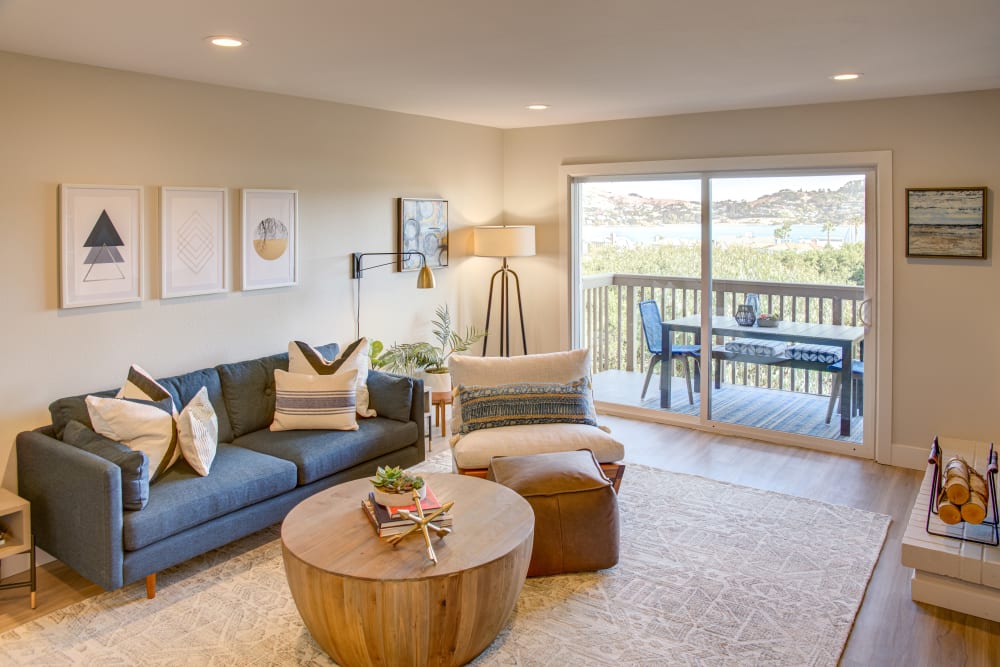 View of the private balcony from a model home's living area at Harbor Point Apartments in Mill Valley, California