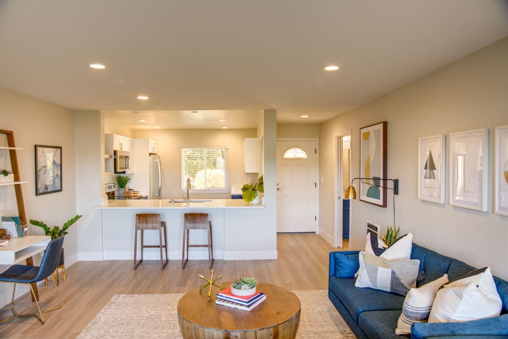 Well-decorated open-concept living space in a model home at Harbor Point Apartments in Mill Valley, California