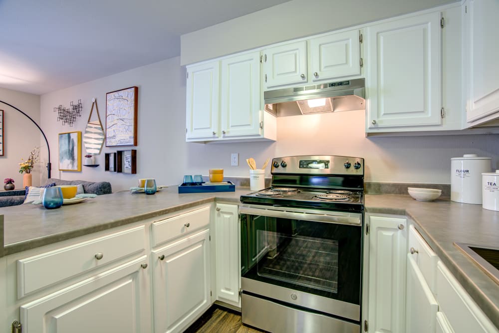 Stainless-steel appliances and granite countertops in a model home's kitchen at Terra Martinez in Martinez, California