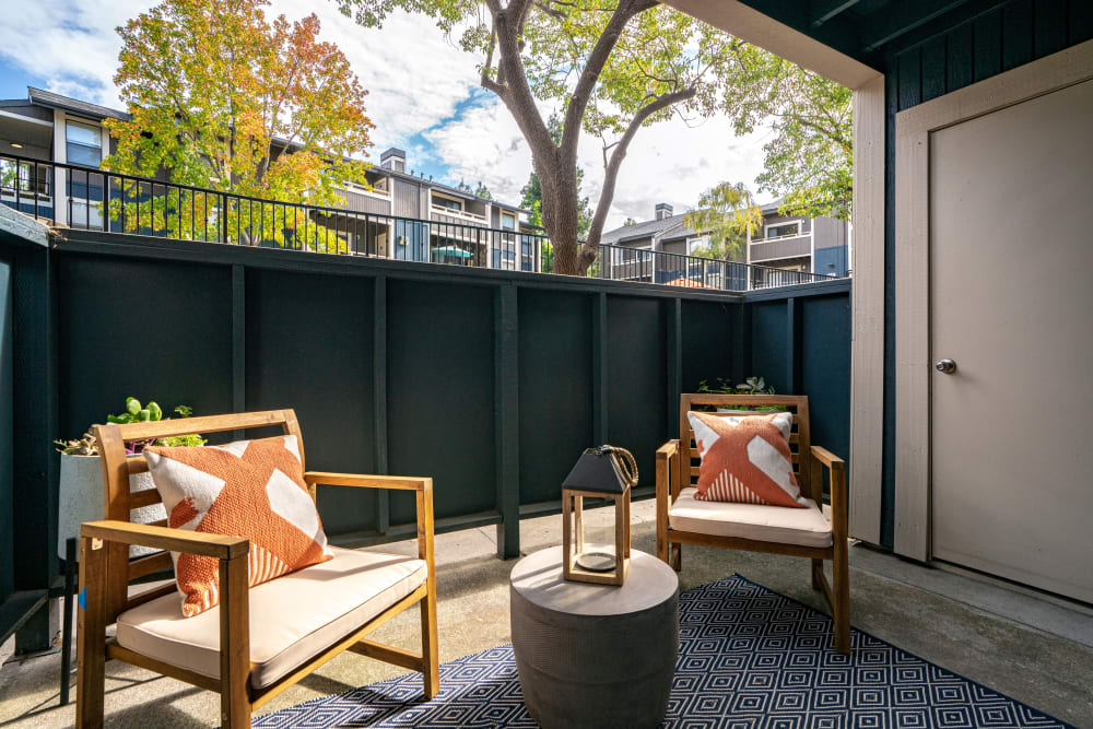 Comfortably furnished private patio outside a model home at Terra Martinez in Martinez, California