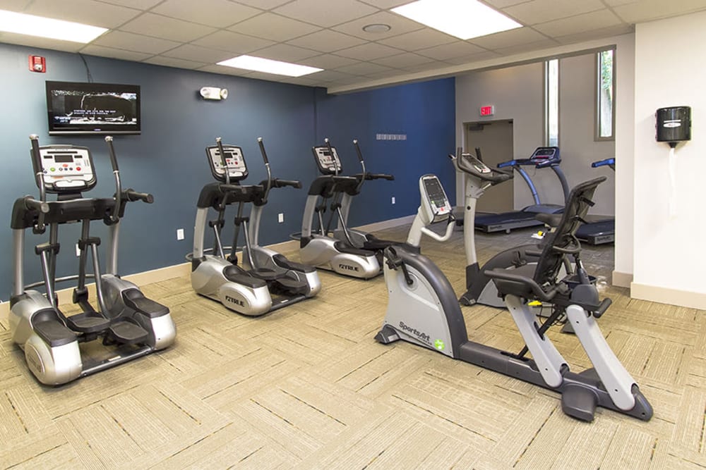 Modern fitness center at Raintree Island Apartments in Tonawanda, New York
