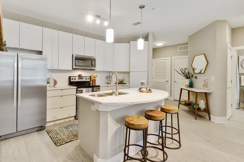 Modern kitchen and island bar at Sky Terrace Townhomes in Stafford, Virginia managed by Hercules Living.