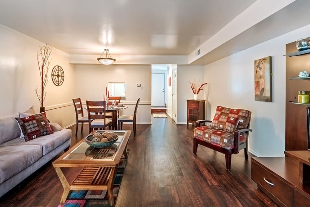 Open concept model home with hardwood-style flooring at The Cascades Townhomes and Apartments in Pittsburgh, Pennsylvania