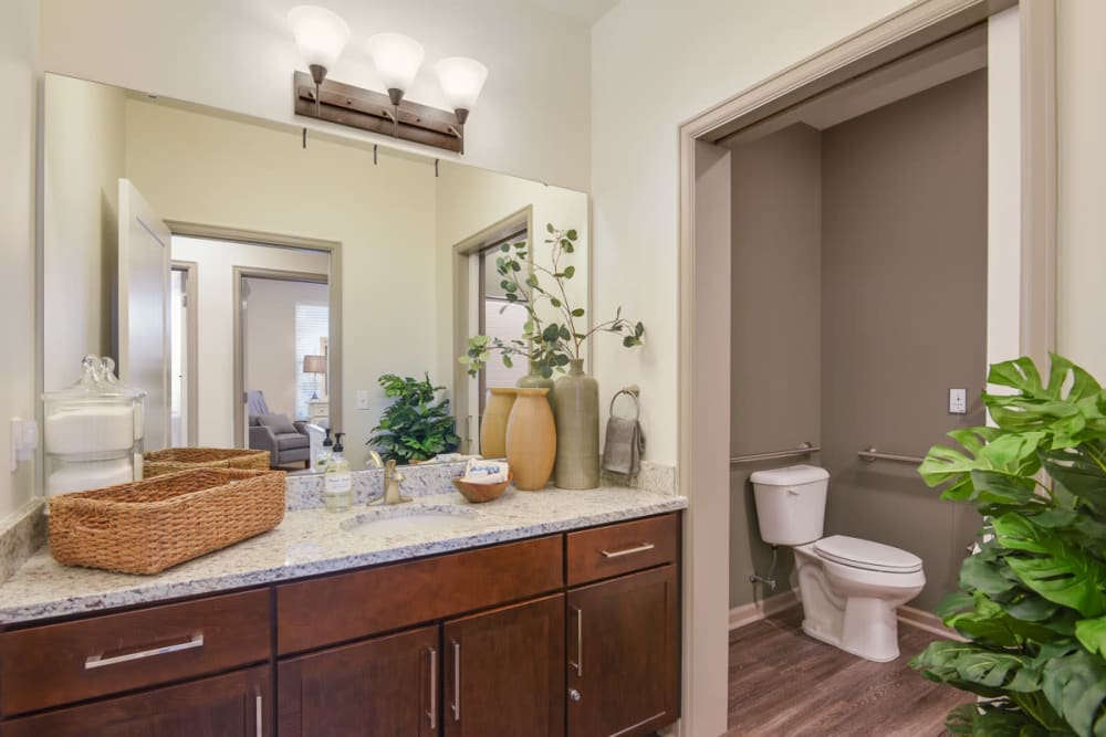 Resident bathroom with storage space at Anthology of Town and Country in Town and Country, Missouri. 