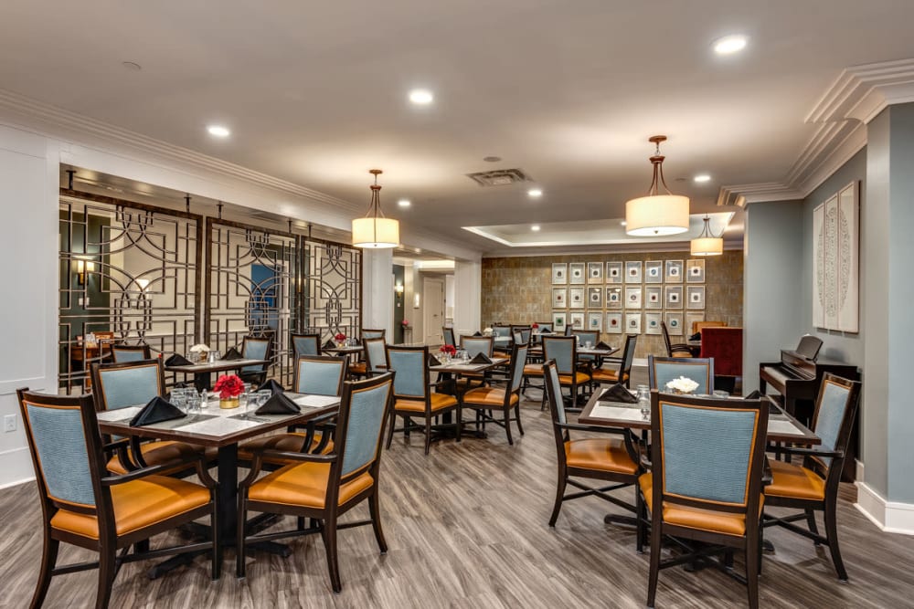Dining room with wood-style flooring at Anthology of Town and Country in Town and Country, Missouri