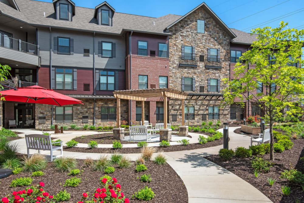 Courtyard with flowers and outdoor seating at Anthology of Town and Country in Town and Country, Missouri