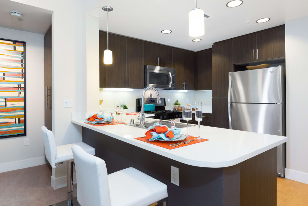 Beautiful kitchen with a large breakfast bar at Sofi Riverview Park in San Jose, California