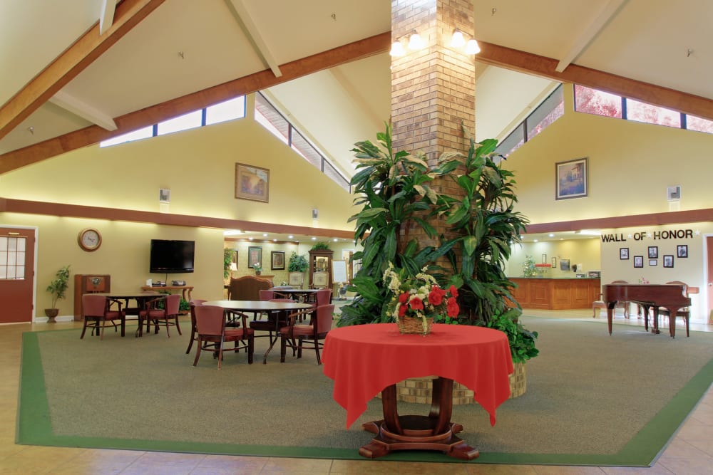 An open and bright activity area at Forest Oaks of Spring Hill in Spring Hill, Florida