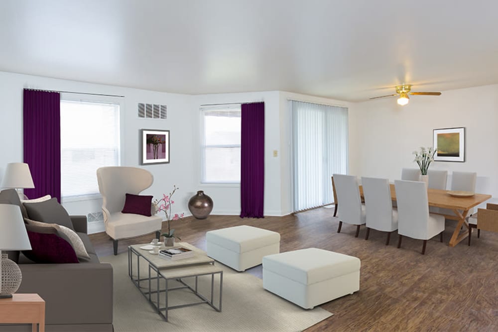 Spacious living room and dining area of an open layout model home at Riverton Knolls in West Henrietta, New York