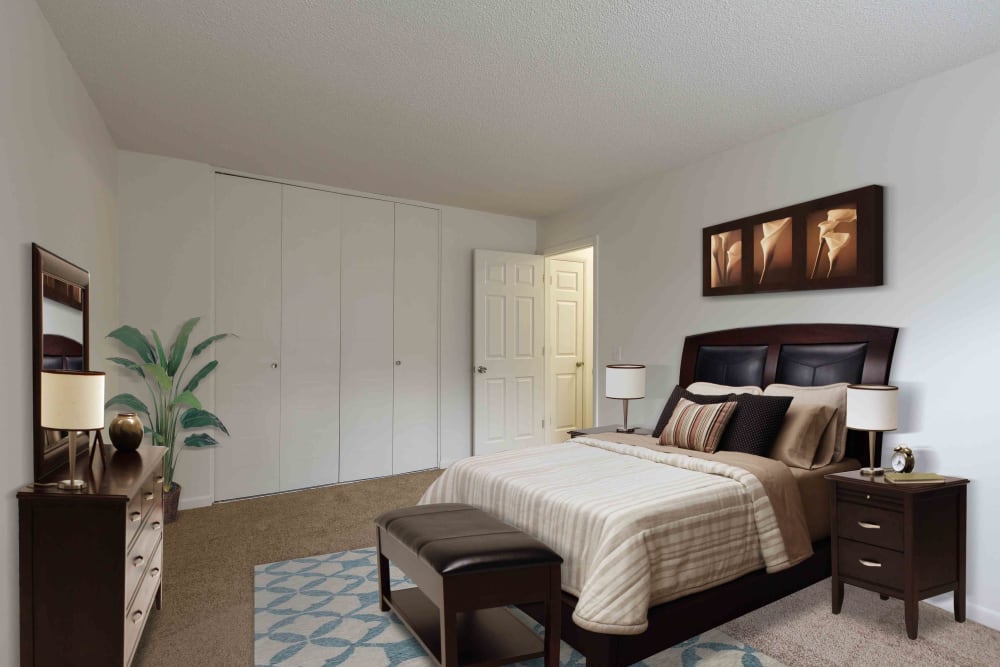 Model bedroom at Penfield Village Apartments in Penfield, New York